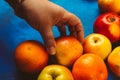 Female hand takes an apple Royalty Free Stock Photo