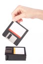 Female hand takes a floppy disk Royalty Free Stock Photo