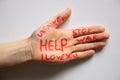 Female hand with text help, stop war, I love you, Ukraine on  background, helping hand to peaceful Ukraine Royalty Free Stock Photo