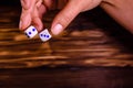 Female hand throwing dice. Gamble concept Royalty Free Stock Photo