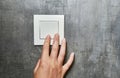 Female hand, to turn off the light, switch, front view Royalty Free Stock Photo