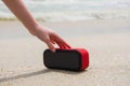 Female hand touch portable speaker Royalty Free Stock Photo