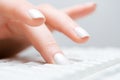 Female hand typing on computer keyboard Royalty Free Stock Photo