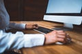 Female hand typing on computer keyboard and other hand holding computer mouse. Woman working at office desk on computer Royalty Free Stock Photo