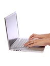 Female hand typing on laptop Royalty Free Stock Photo