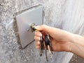 Female hand unlocks garage Royalty Free Stock Photo