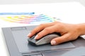 Female hand using mouse on digital tablet. Royalty Free Stock Photo