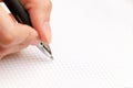 Female hand writes a pen in notebook Royalty Free Stock Photo
