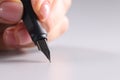 Female hand writing black fountain pen closeup Royalty Free Stock Photo