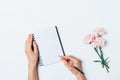 Female hand writing in empty notebook Royalty Free Stock Photo