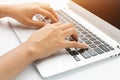 Female hand writing on laptop, close up Royalty Free Stock Photo