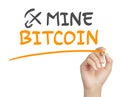 Female hand writing mine bitcoin message with marker on white background Royalty Free Stock Photo