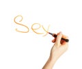 Female hand writing the word Royalty Free Stock Photo