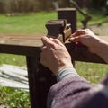 Female hands adjusting rusty vice