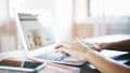 Female hands on an aluminum laptop keyboard typing Royalty Free Stock Photo