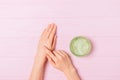 Female hands apply aloe gel on skin Royalty Free Stock Photo