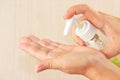 Female hands applying liquid soap closeup