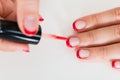 Female Hands Applying Nail Varnish Royalty Free Stock Photo