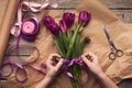 Female hands arranging tulips bouquet Royalty Free Stock Photo