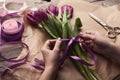 Female hands arranging tulips bouquet Royalty Free Stock Photo