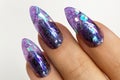 Female hands with beautiful colorful hybrid nails and professional manicure.