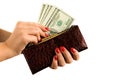 Female hands with a beautiful manicure hold a purse and money. Royalty Free Stock Photo