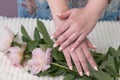 female hands with a beautiful peach manicure design, color 2024, pastel colors, delicate spring dewy peonies