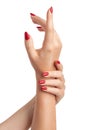 Female Hands a beautiful well-groomed woman with feminine red nails on a white background. Manicure Royalty Free Stock Photo