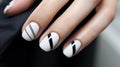 Female hands with black and white nail design. Nail polish manicure Royalty Free Stock Photo