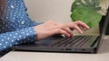 Female hands of a business woman working on computer. Student girl typing text on laptop keyboard. Woman sitting at home Royalty Free Stock Photo