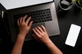 A female hands or businesswoman typing on notebook laptop keyboard on black workspace Royalty Free Stock Photo