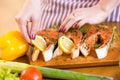 Female hands close up cooking fish in domestic Royalty Free Stock Photo