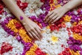 Female hands close up on flowers petals, Young woman takes a bath in the tub full of petals, spa weekend, wellbeing, body care and Royalty Free Stock Photo