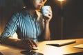 Female hands close up using computer mouse at home work process, isolation manager working drink coffee at night Royalty Free Stock Photo