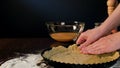 Female Hands Coating Dough Round a Baking Pan Royalty Free Stock Photo