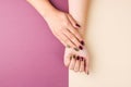 Female hands on color background, top view. Colorful creative manicure. Nail and hand care Royalty Free Stock Photo