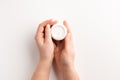 Female hands with container of cream isolated, on white background Royalty Free Stock Photo