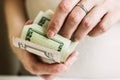 Female hands counting us dollars. Woman hand count the united states currency. A bunch of american Banknotes. The world currency Royalty Free Stock Photo