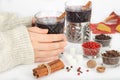 Female hands with cup of delicious Christmas mulled wine Royalty Free Stock Photo