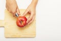 Female hands cut apple on cutting board. Natural product concept. Top view