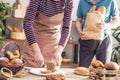 Female hands cutting whole wheat bread