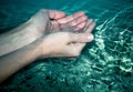 Female hands in water