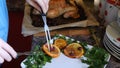 Female Hands Decorate Roasted Whole Chicken on Plate For Family Dinner Royalty Free Stock Photo