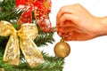 Female hands decorating a christamss tree