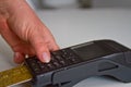 Female hands entering credit card PIN for password security in terminal Royalty Free Stock Photo