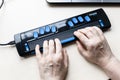 Female hands on Focus 40 Blue Braille Display