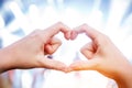 Female hands in the form of heart on a light background Royalty Free Stock Photo
