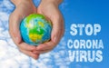 Female hands with globe, stop corona virus