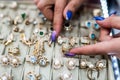 Female hands with golden jewellery in shop close up Royalty Free Stock Photo