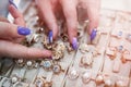 Female hands with golden jewellery in shop close up Royalty Free Stock Photo
